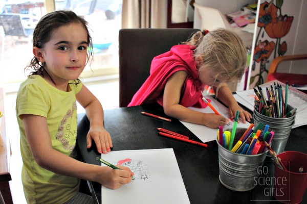 Girl colouring in Ariel (from The Little Mermaid) as a Scientist picture