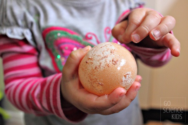 Dissolving the eggshell off an egg