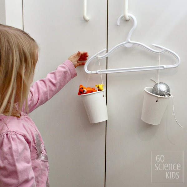 Easy DIY balance scales to introduce concepts of weight and gravity to toddlers and preschoolers