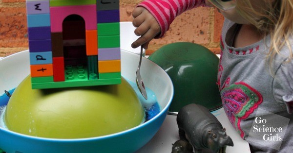 Adding baking soda to turn the castle moat into fluffy clouds