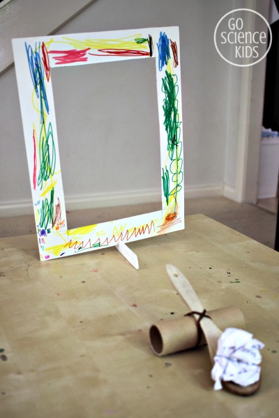 Make a catapult target using a cardboard frame and a comb stand